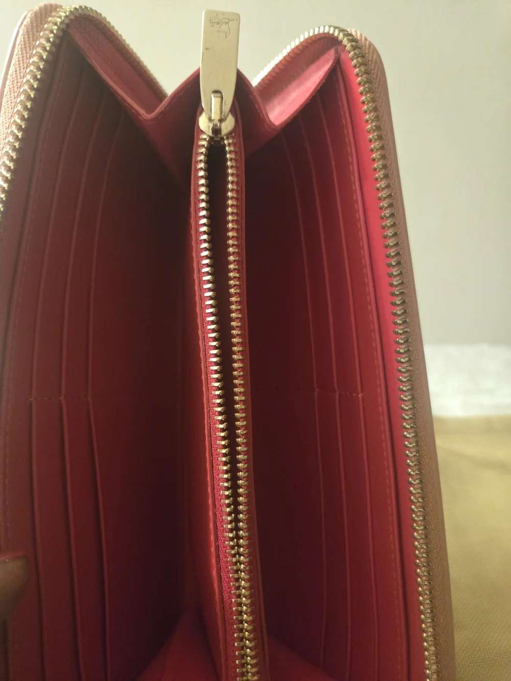 Christian Louboutin Blush Pink Studded Zip-Around Wallet with Gold Spikes